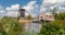 Panorama of flowers in front of a windmill in Leiden