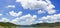 Panorama fluffy clouds against in blue sky