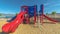 Panorama Focus on slides at a park with view of lake and distant timapanogos mountains