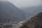 Panorama of the foggy winter landscape in the mountains with snow and rocks, Azerbaijan, Lahic, Big Caucasus