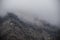 Panorama of the foggy winter landscape in the mountains with snow and rocks, Azerbaijan, Lahic, Big Caucasus