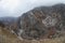 Panorama of the foggy winter landscape in the mountains with snow and rocks, Azerbaijan, Lahic, Big Caucasus