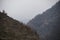 Panorama of the foggy winter landscape in the mountains with snow and rocks, Azerbaijan, Lahic, Big Caucasus