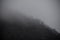 Panorama of the foggy winter landscape in the mountains with snow and rocks, Azerbaijan, Lahic, Big Caucasus