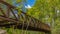 Panorama frame Bridge with metal guardrails over the glistening water at Ogden River Parkway