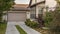 Panorama frame Concrete driveway leading to a double garage