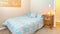 Panorama frame Cozy bedroom with twin bed, carpet and himalayan sea salt lamp on the nightstand