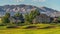 Panorama frame Fairway and bunker of golf course in front of homes with lake and mountain view