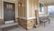 Panorama frame Front of a home with Welcome sign and furniture on the porch