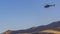 Panorama frame Helicopter flying over an immense mountain with clear blue sky background