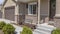 Panorama frame Home facade with driveway and stairs leading to the garage door and front door