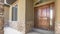 Panorama frame Home porch and brown wood front door with sidelights and arched transom window