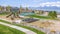 Panorama frame Houses and park with playground and picnic area on a neighborhood near a lake