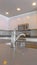 Panorama frame Modern kitchen of a new home with close up on the shiny faucet and sink