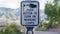 Panorama frame Pedestrian push button station at a crosswalk against blurred road and mountain