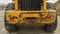 Panorama frame Rear view of a loader against snow covered ground and cloudy blue sky in winter