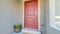 Panorama frame Red wooden front door at the entrance of a home with concrete exterior wall