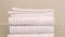 Panorama frame Stack of clean white ribbed towels in a bathroom