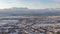 Panorama frame Sunset in Utah Valley with homes on a snowy neighborhood with mountain view