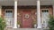 Panorama frame Symmetrical house facade with covered porch near sunset