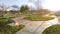 Panorama frame Vast park with pathways and trees on the grassy ground under the blazing sun