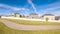 Panorama frame Winding walkway through a grassed park during day