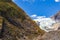 Panorama of Franz Joseph Glacier. Around the cliffs and ice. South Island, New Zealand