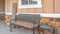 Panorama Front porch of a home with a bench and stool in front of the window