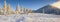 Panorama of the frosty morning in winter mountains.