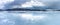 Panorama of frozen lake in Northern Mountains starting to melt and water flows on the ice surface. Joesjo lake in Lappland,