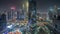 Panorama of futuristic skyscrapers in financial district business center in Dubai night timelapse