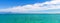 Panorama of Garda Lake azure turquoise water with view of Monte Baldo mountain range and Sirmione peninsula
