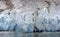 Panorama - glacial icefall on ocean fjord,