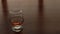 Panorama, glass goblet with cognac, standing on the kitchen table.