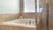 Panorama Glass walled shower stall and circular bathtub inside modern bathroom of home