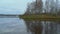 Panorama of gloomy morning on Bank of the Volga river in Yaroslavl region, Russia. Church of the Holy Trinity in village of Dievo
