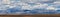 Panorama of the Gobi desert, the Expanses of Mongolia, mountains on the horizon, Blue sky with clouds. The serenity of the