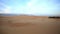 Panorama of Gold Dunes against Sky at Sunset