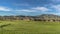 Panorama Golf course and houses with view of mountain towering in the distance