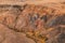 Panorama gorge in mountains. Beautiful Landscape red mountains in cloudy weather. Gorge Martian landscapes. Panorama of desert