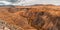 Panorama gorge in mountains. Beautiful Landscape red mountains in cloudy weather. Gorge Martian landscapes. Panorama of desert