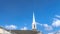 Panorama Gray roof and white steeple of church on winter view of snowy Wasatch Mountains