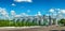 Panorama of group of granaries for storing wheat and other cereal grains. Cloudly sky