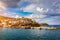 Panorama of Harbour with vessels, boats, beach and lighthouse in Bali at sunrise, Rethymno, Crete, Greece. Famous summer resort in