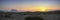 Panorama of a hazy sunset at Factory Butte in Utah