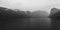 Panorama of Hetch Hetchy Reservoir and Waterfalls on Mountain Cliff on a Winter Foggy Day in Yosemite National Park, California