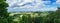 Panorama from a high altitude to a valley with fields and windmills. Hof, Bavaria, Germany.