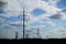 Panorama of high voltage substation. Distribution electrical power. Silhouettes of pylons and towers