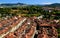 Panorama of the historic part of Bern with red-roofed houses and mountains in the background