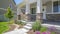 Panorama Home facade with plants flowers and pathway on the yard in front of the poch